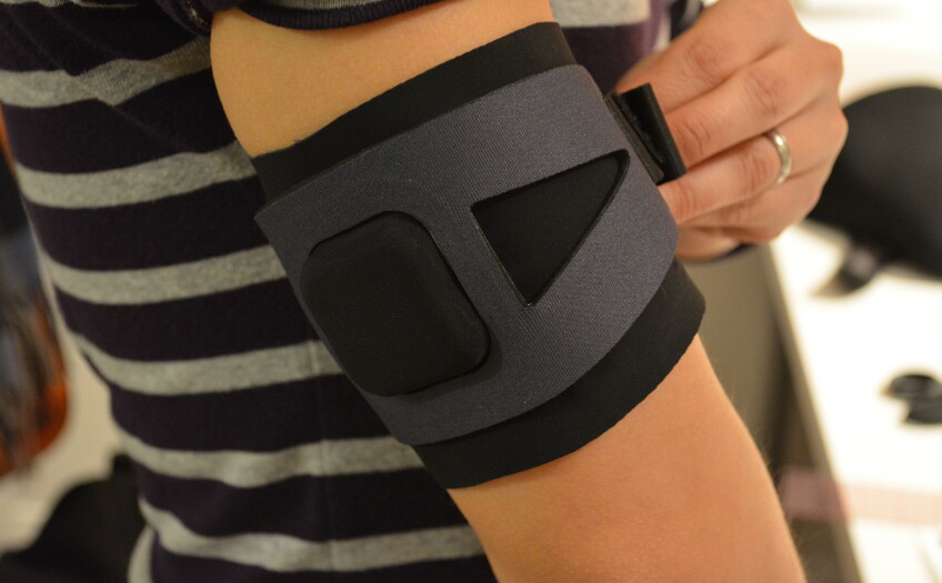 A model wears a black and grey armband