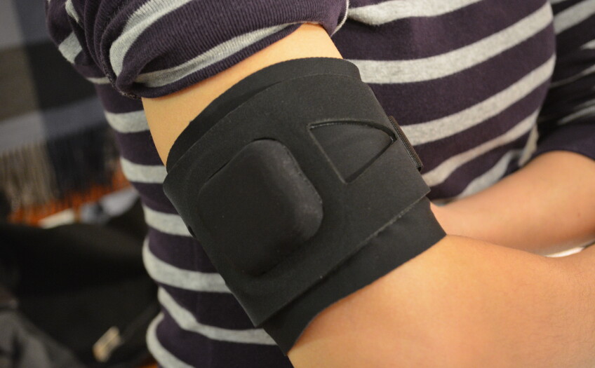 A model wears a black and black armband.