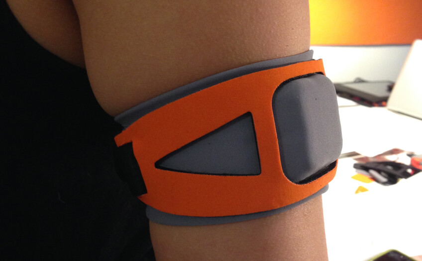 A model wears a grey and orange armband