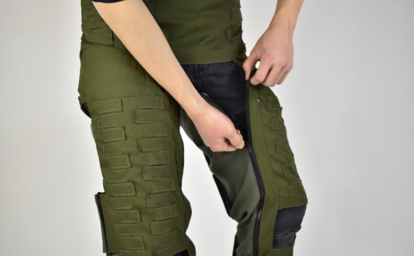 Model demonstrates the Anti-G Trouser inseam zipper detail