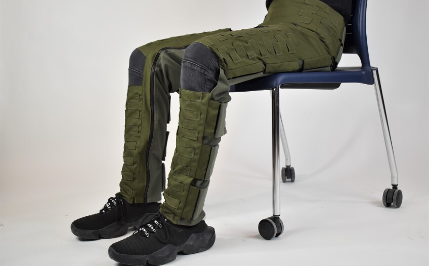 Seated figure wearing Anti-G Trousers