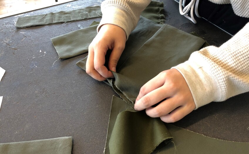 Designer works on the Anti-G Trouser prototype