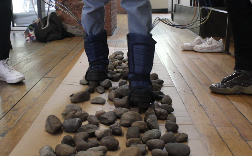Model walks on rocks with moon boots