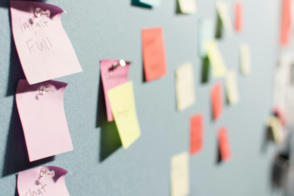 multi-color post-its on a wall