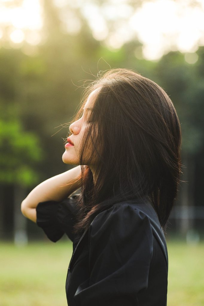 woman facing the sun