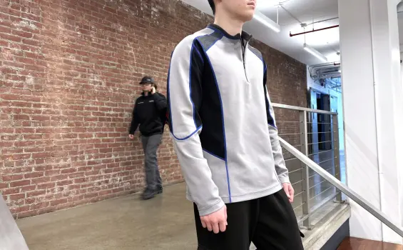 Smart garment prototype featuring integrated electronics in the center back panel