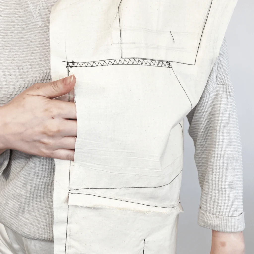 Muslin mockup of the Perci Emergency Preparedness Vest used to test pocket placement and accessibility
